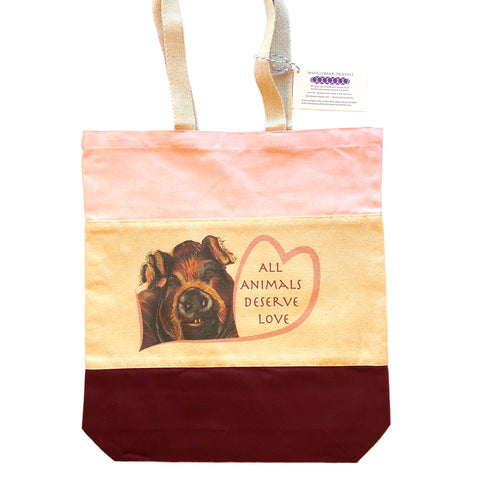 Rescued Pig tote bag with maroon and pink panels. Bella is a pig that lives at Loving Farm Animal Sanctuary in California